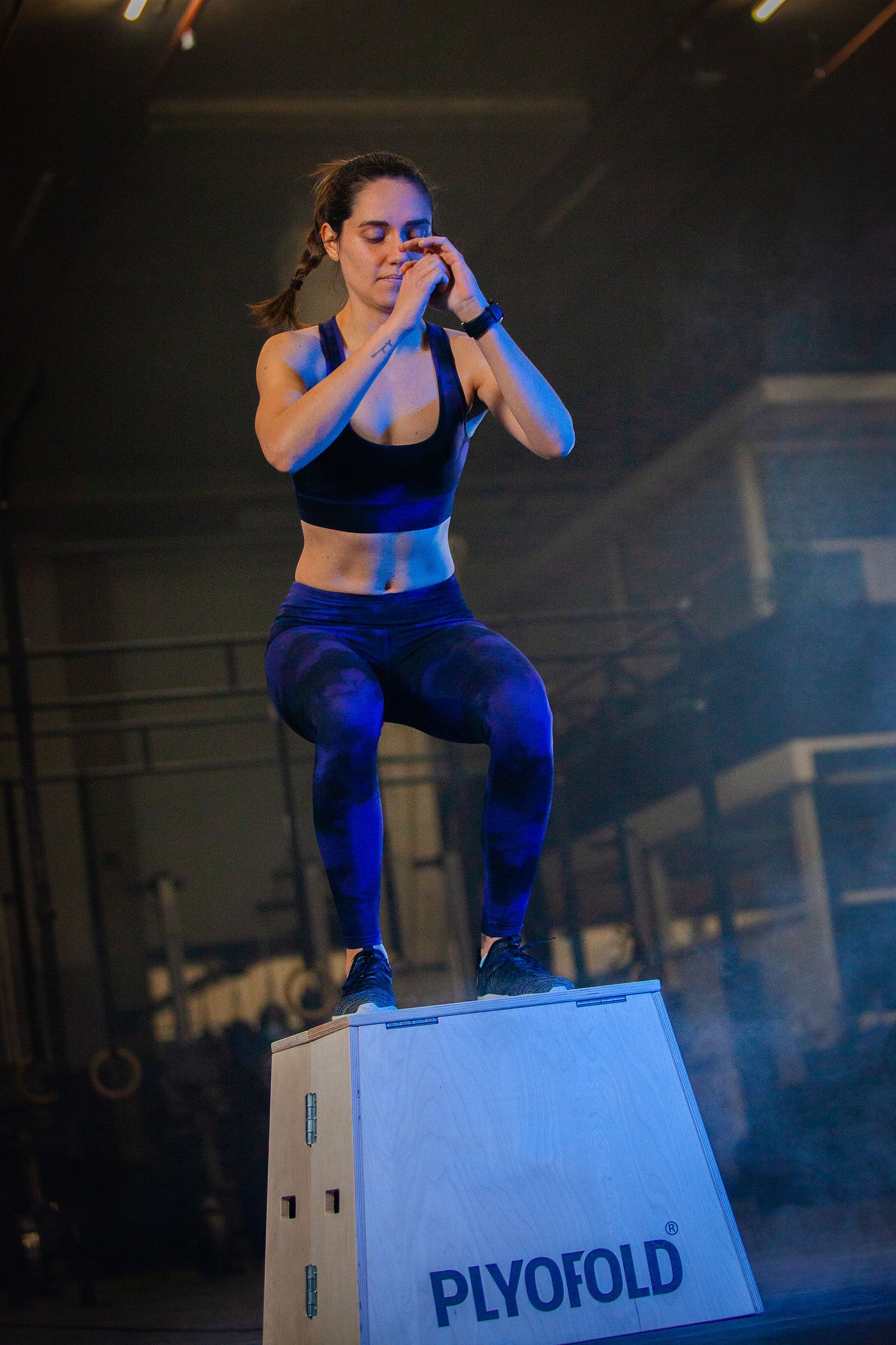 Athlete performing a plyometric box jump onto the Plyofold